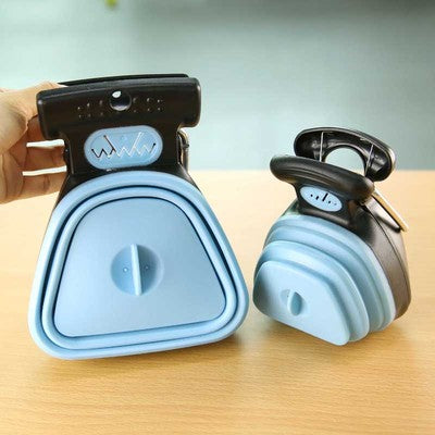 Two foldable dog pooper scoopers in blue and black shown open and folded on a wooden table