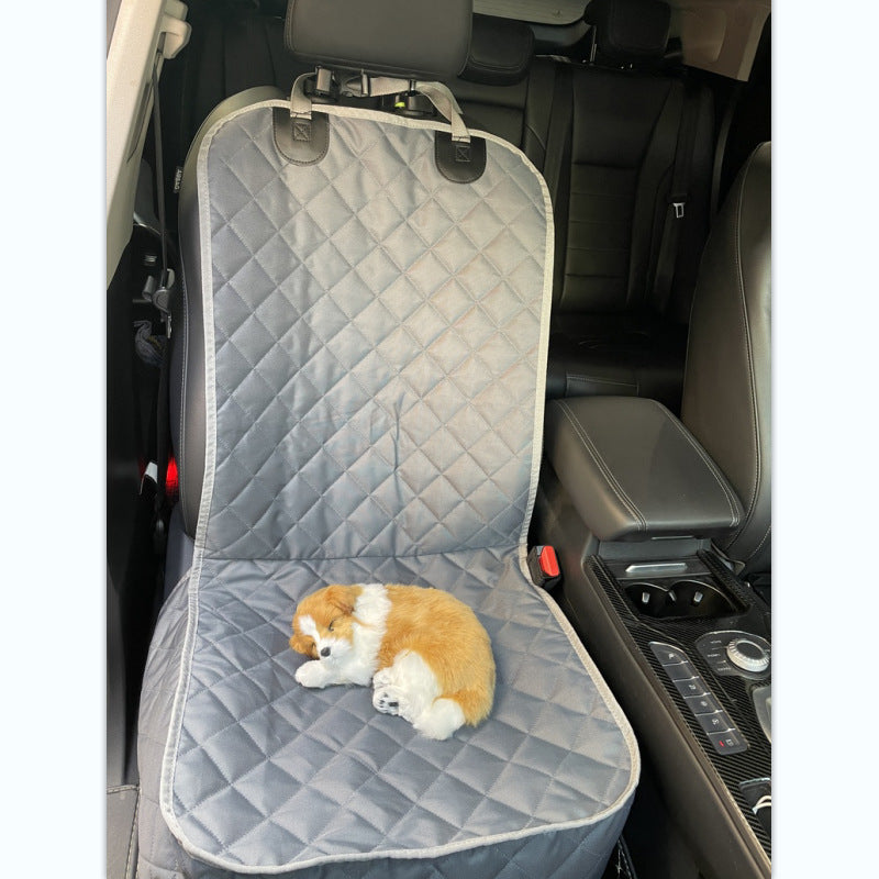 Quilted dog car seat cover fitted on a front car seat with a small dog resting on it