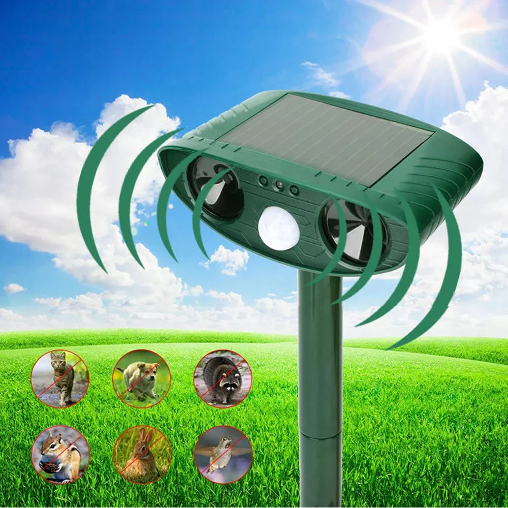 Green solar ultrasonic animal repellent on a garden stake emitting sound waves in a sunny grassy field, with crossed-out icons of a cat, dog, raccoon, chipmunk, rabbit, and rat.